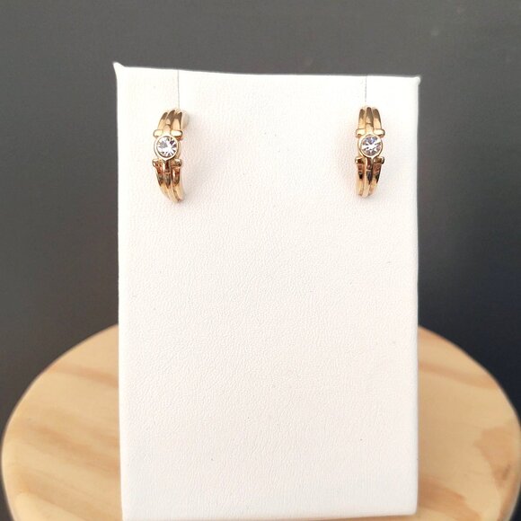 Curved gold tone earrings with faux diamond centers - Picture 5 of 8